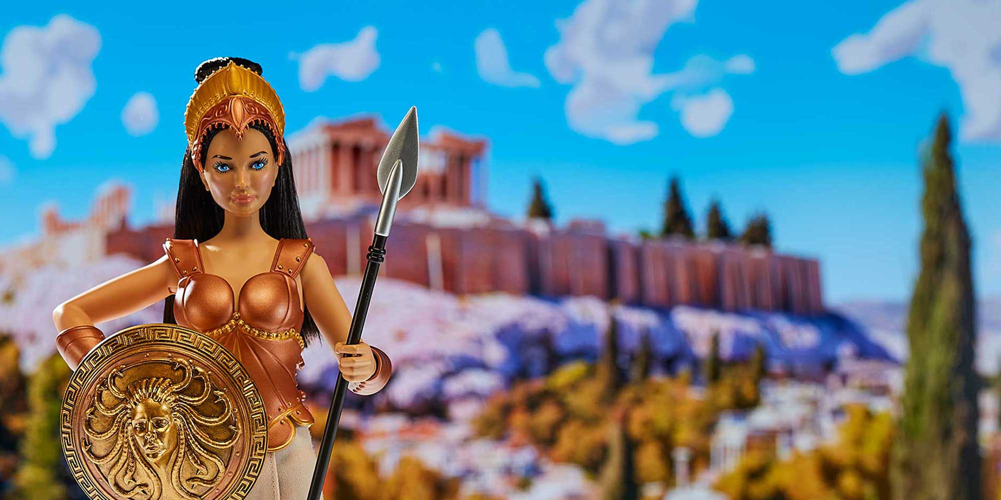 Athena doll with spear and shield with the Acropolis in the background